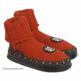Knitted slippers with Edelweiss alpine flower ornament - Knitted slippers for all the family made by the traditional production in South Tyrol! These attract...