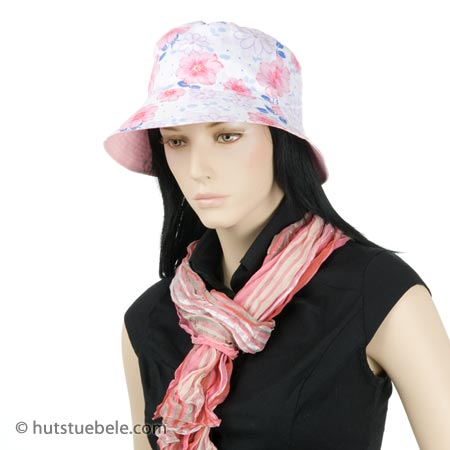 Summer hat in bright colors with floral pattern
